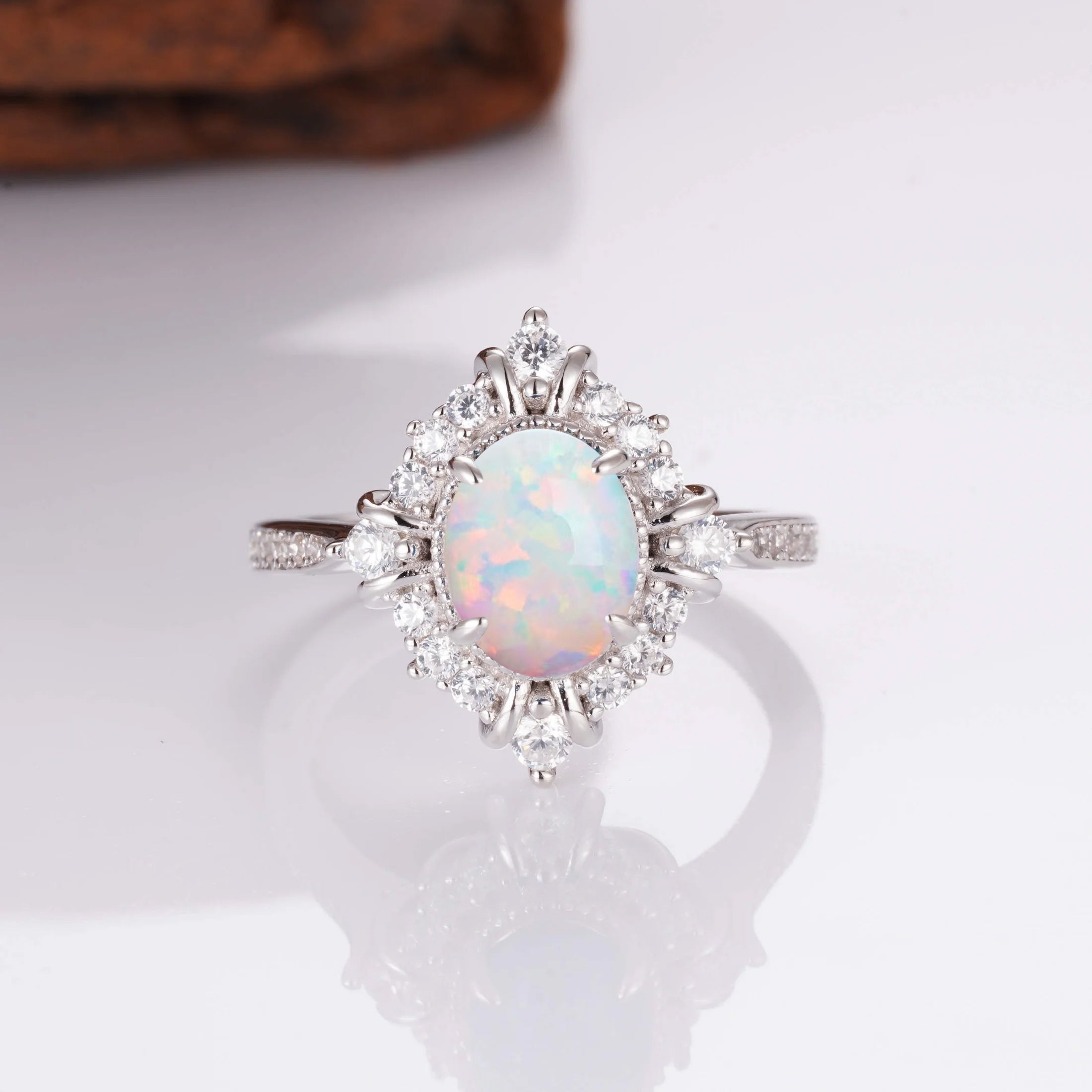 Sterling silver opal ring with glowing colors and crystals