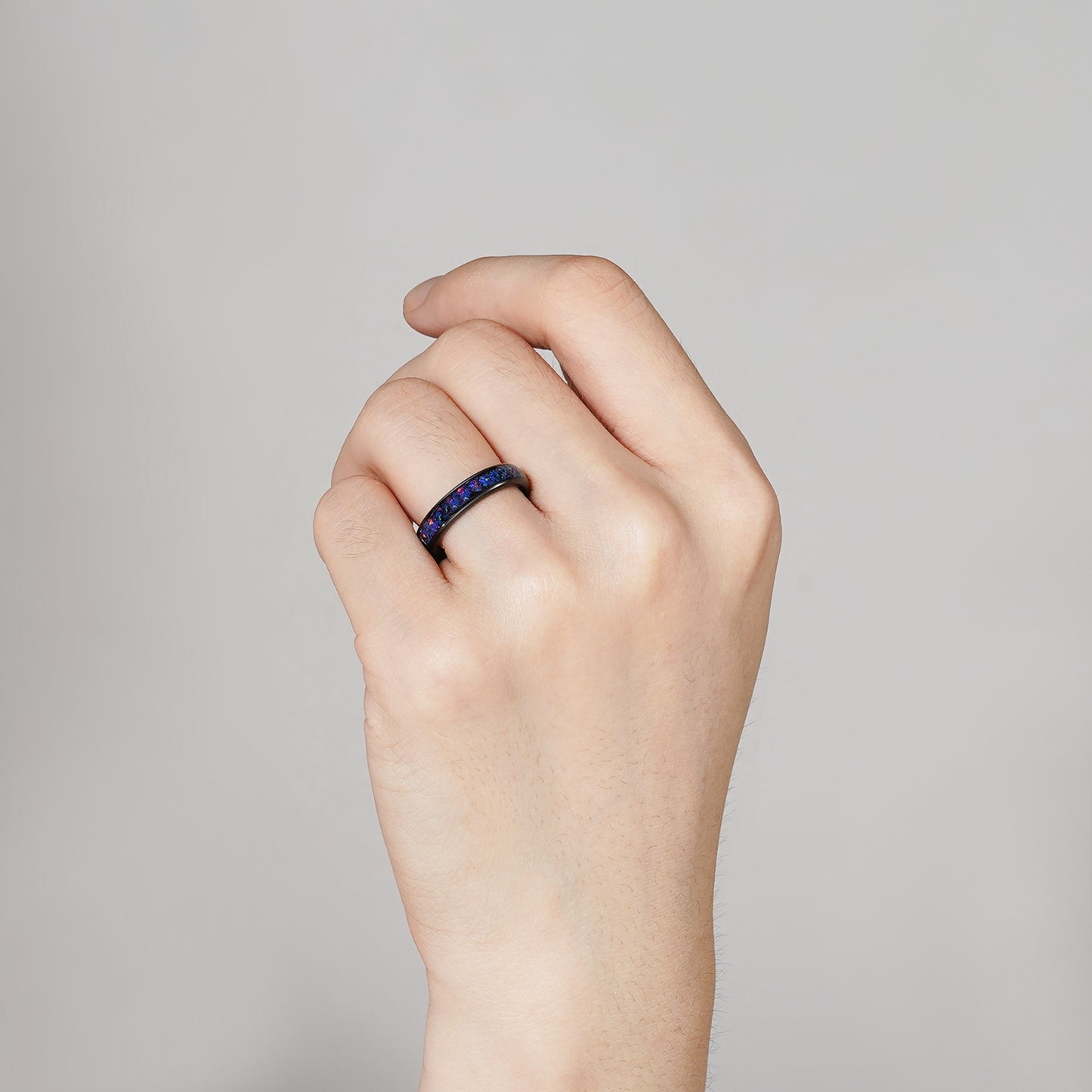 Tungsten ring with opal and cosmic gemstone details