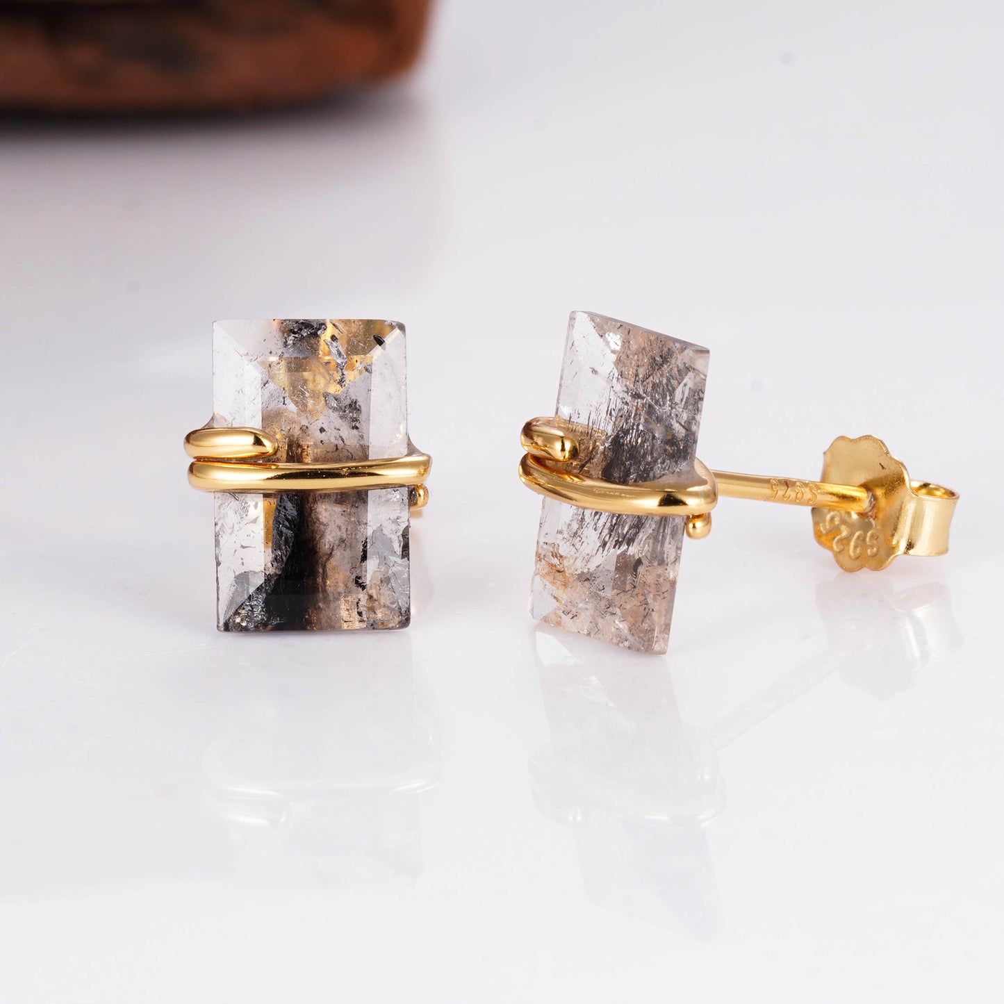Salt and pepper diamond earrings with emerald cut design