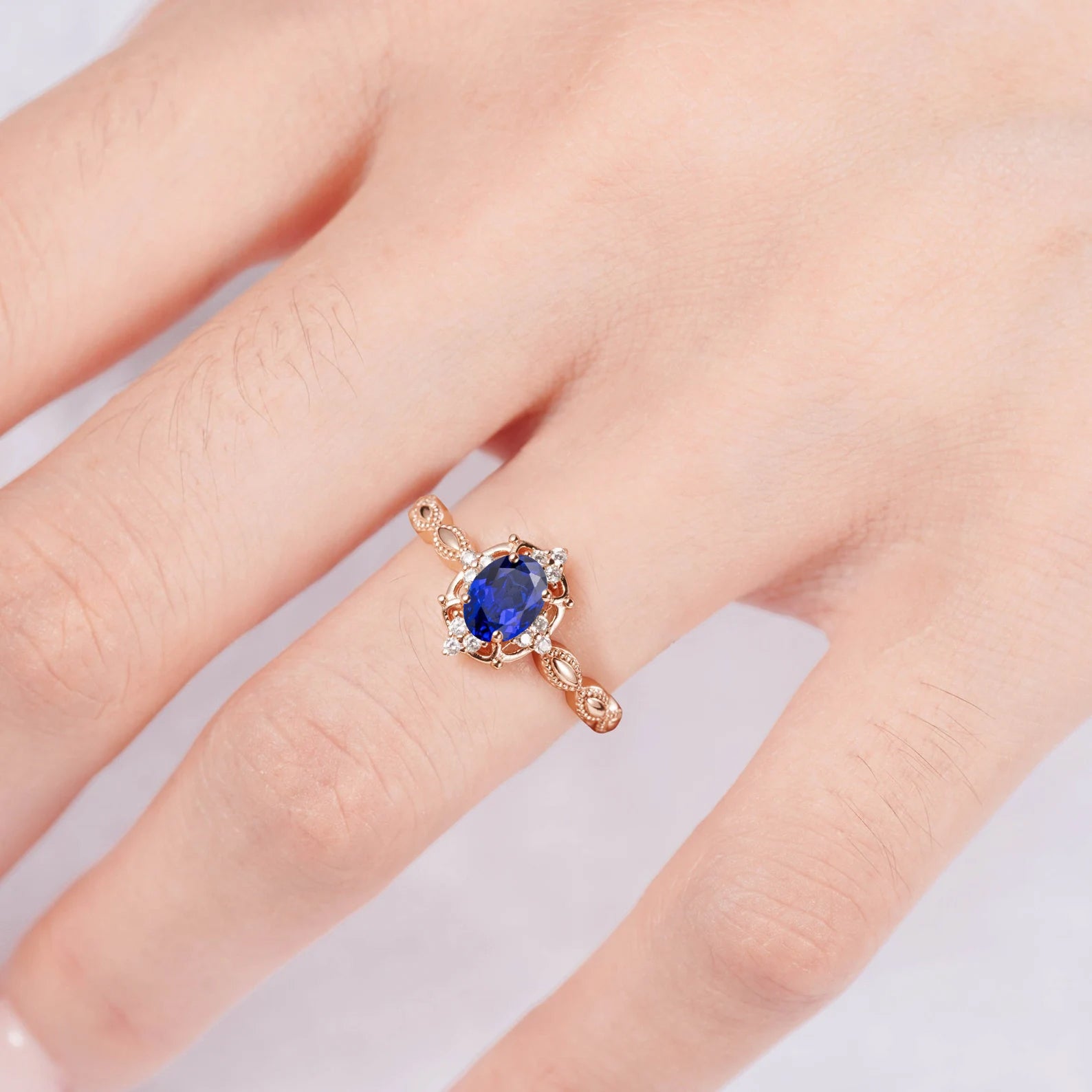 Rose gold sapphire ring with white sapphire and crystal accents