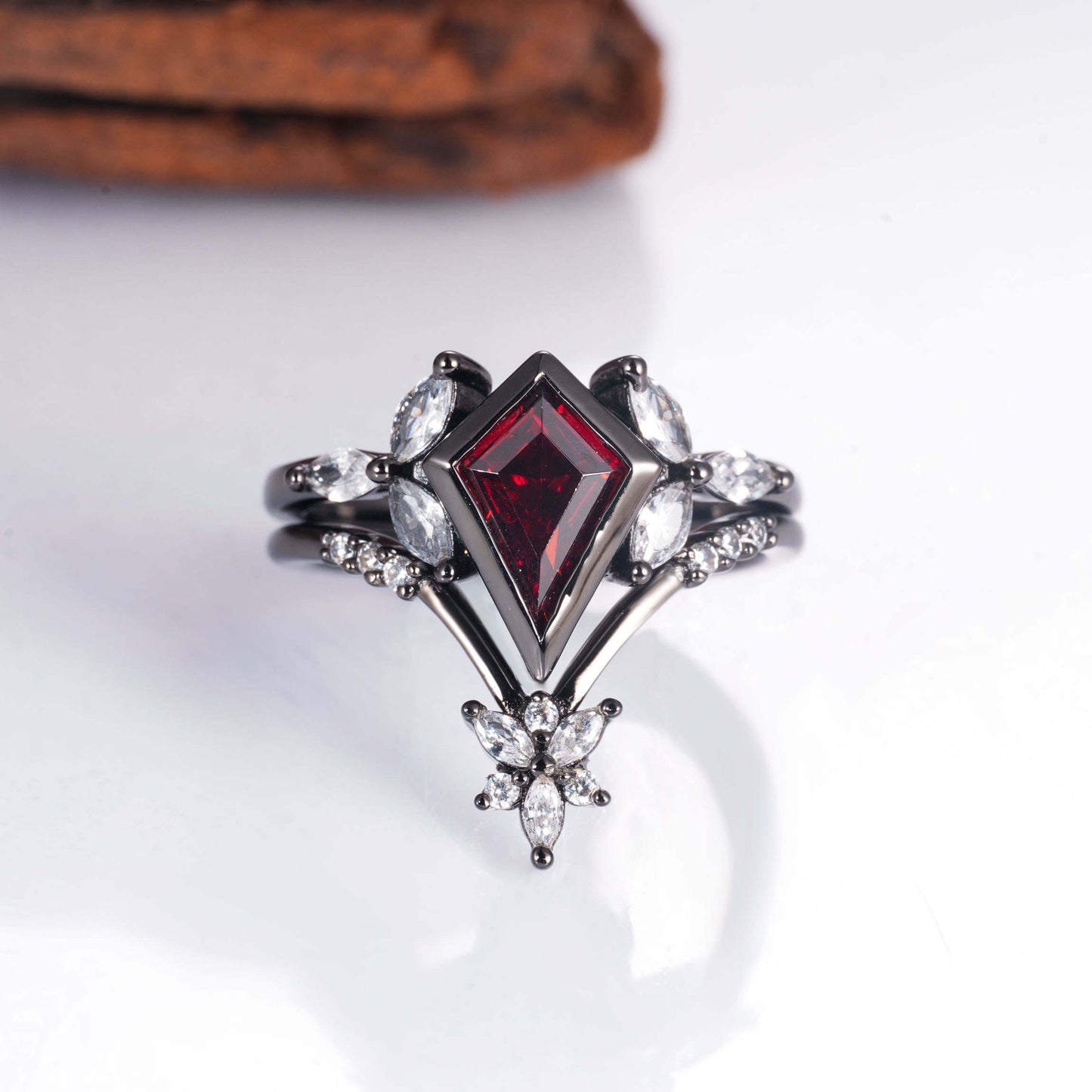 Garnet ring set in black gold vermeil with crystal accents