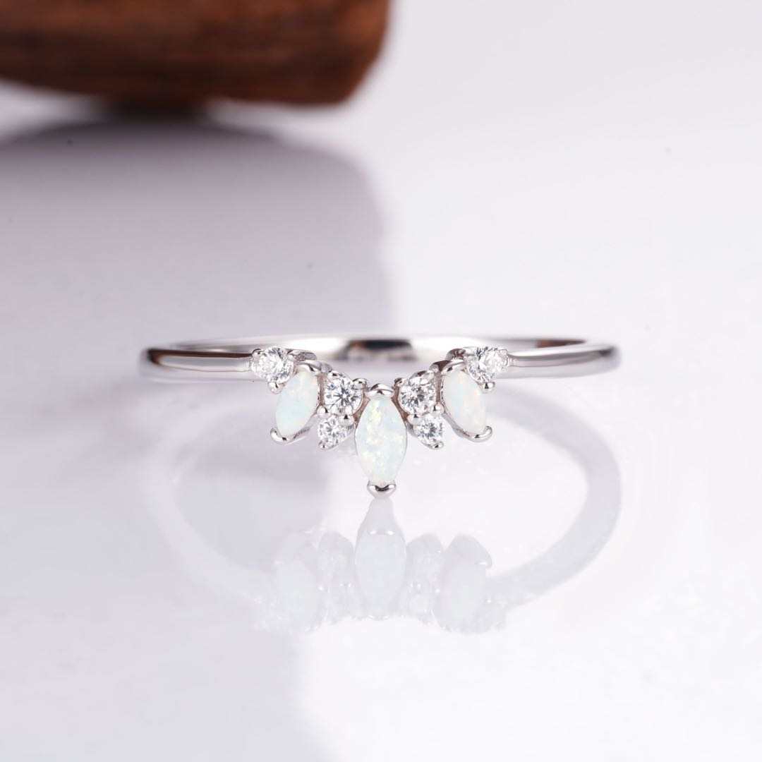 Curved sterling silver opal ring with glowing opal stones