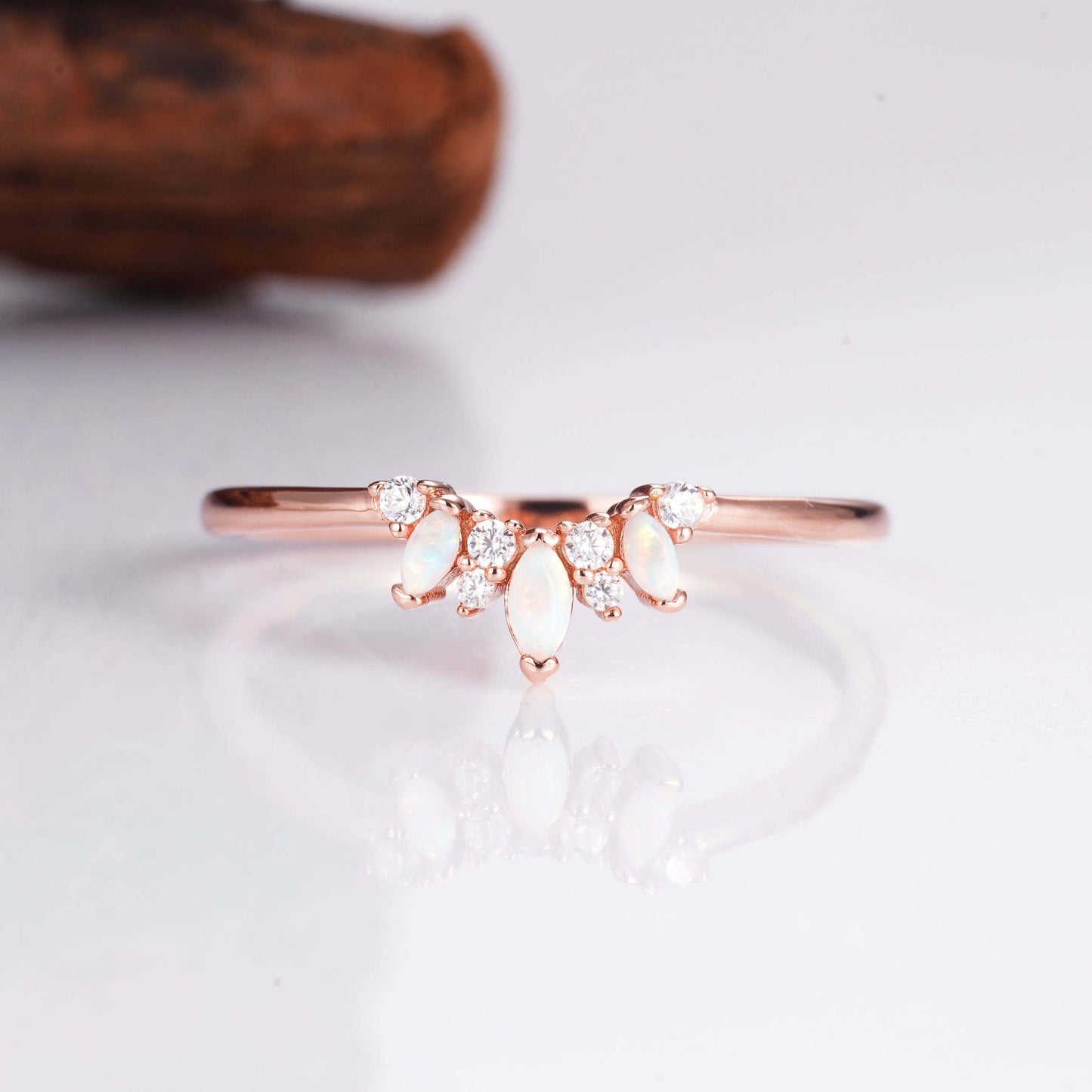 Curved sterling silver opal ring with glowing opal stones