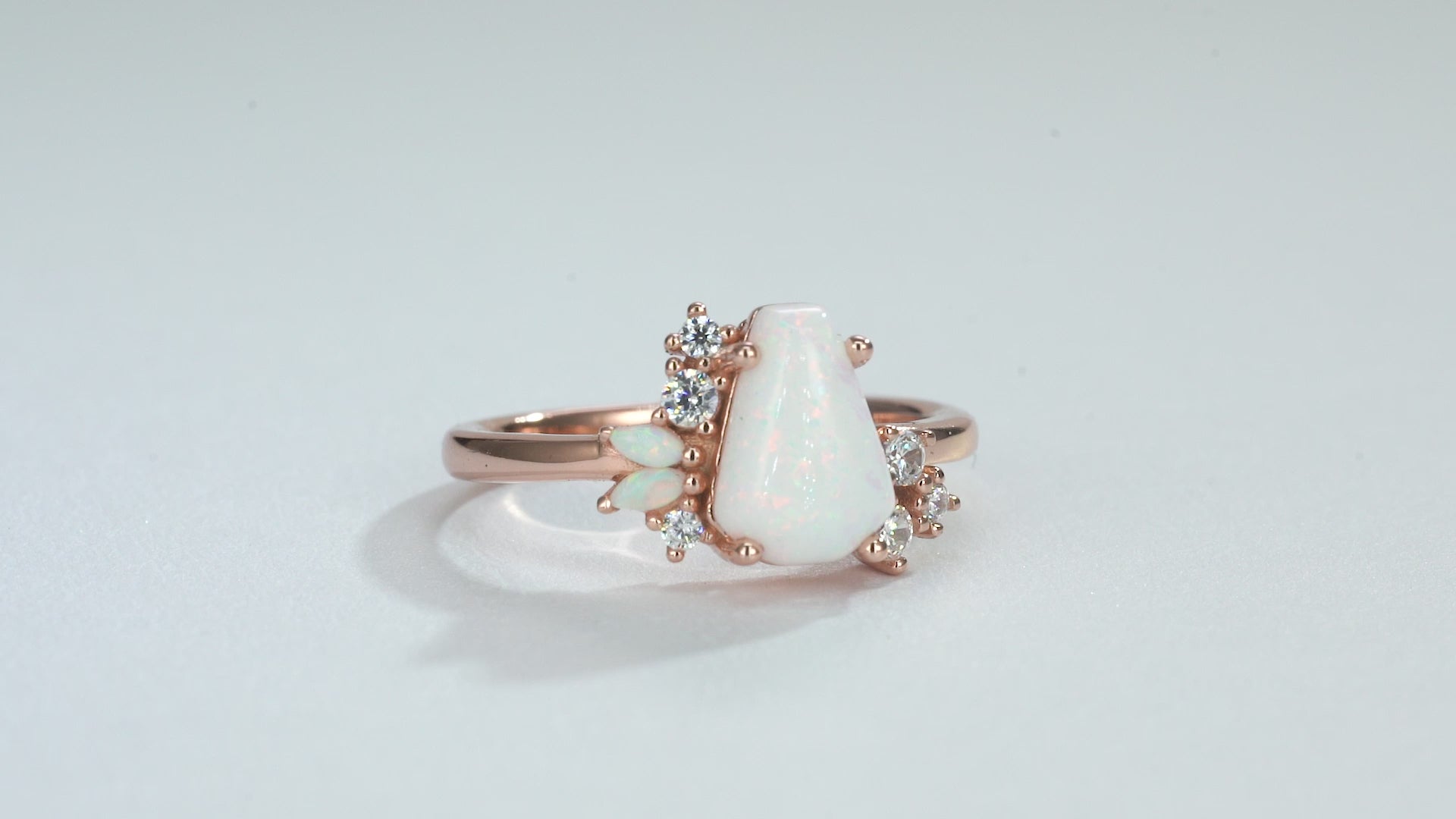 Coffin-cut opal ring in rose gold with moissanite accents